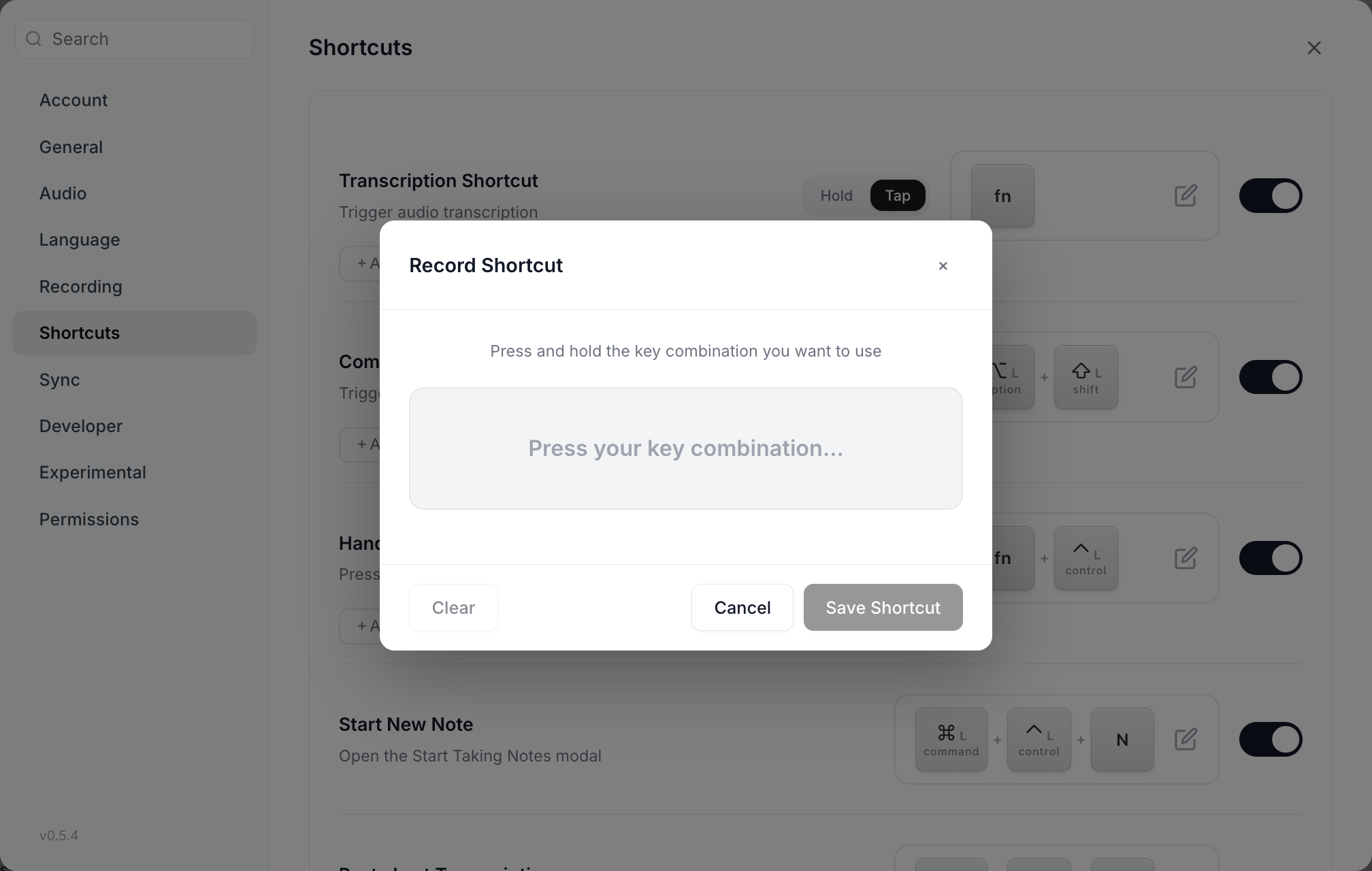 The Record Shortcut dialog reading Press and hold the key combination you want to use, with Clear, Cancel and Save Shortcut buttons