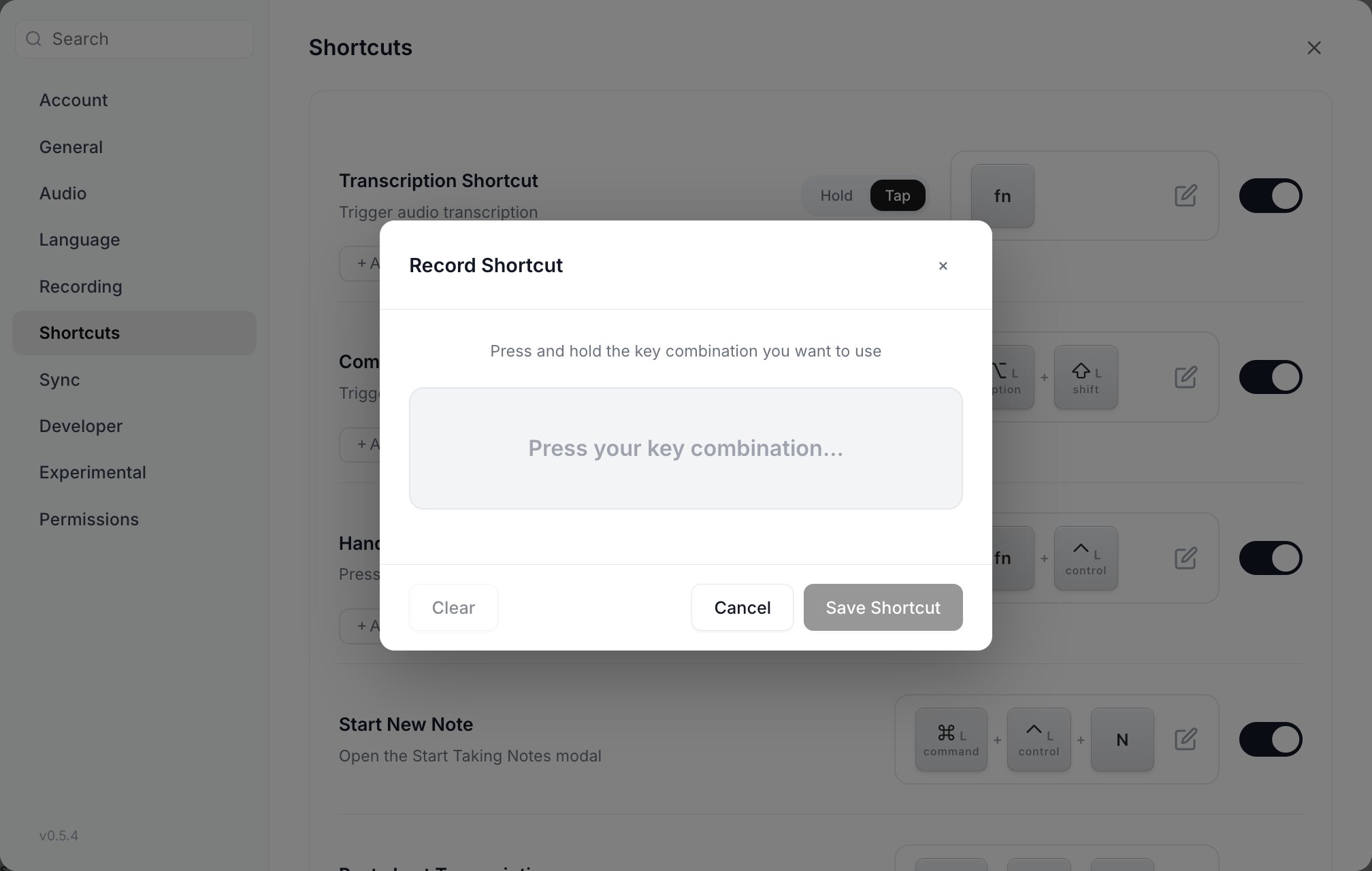 The Record Shortcut dialog reading Press and hold the key combination you want to use, with Clear, Cancel and Save Shortcut buttons