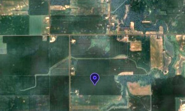Map pointer on satellite image of crop fields