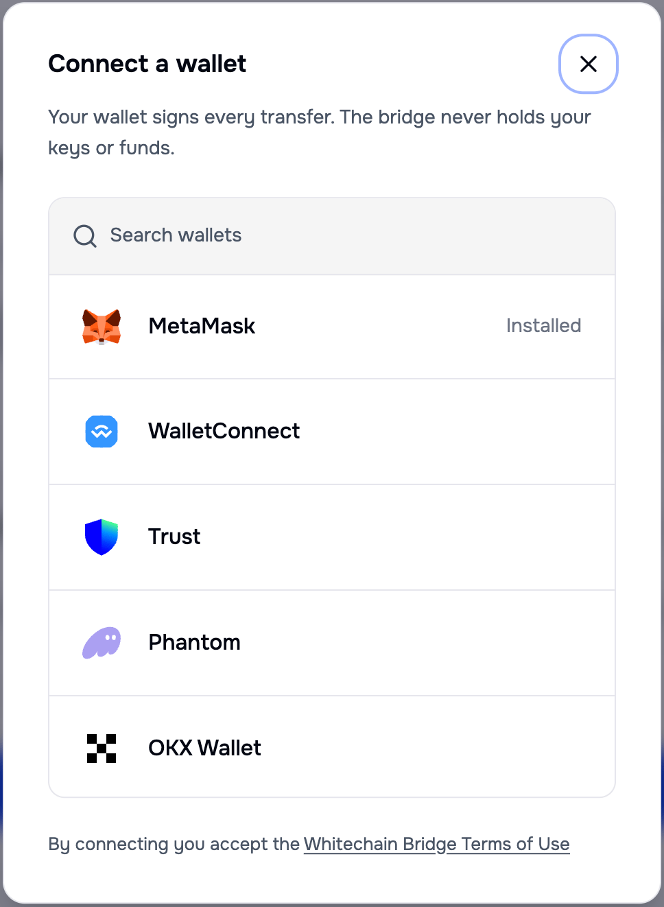 Connect a wallet dialog with a search field and entries for MetaMask marked Installed, WalletConnect, Trust, Phantom, and OKX Wallet, above a link to the Whitechain Bridge Terms of Use