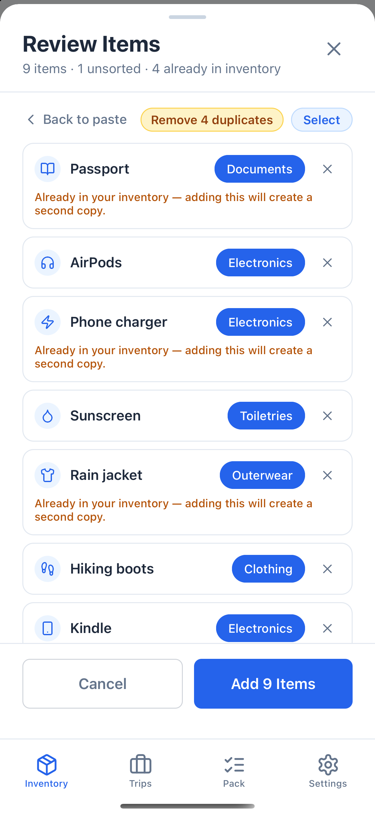 The Review Items screen for nine items. AirPods and Kindle are suggested as Electronics, Sunscreen as Toiletries and Rain jacket as Outerwear. Rows already in the inventory carry a note saying so, and a Remove 4 duplicates button sits above the list.