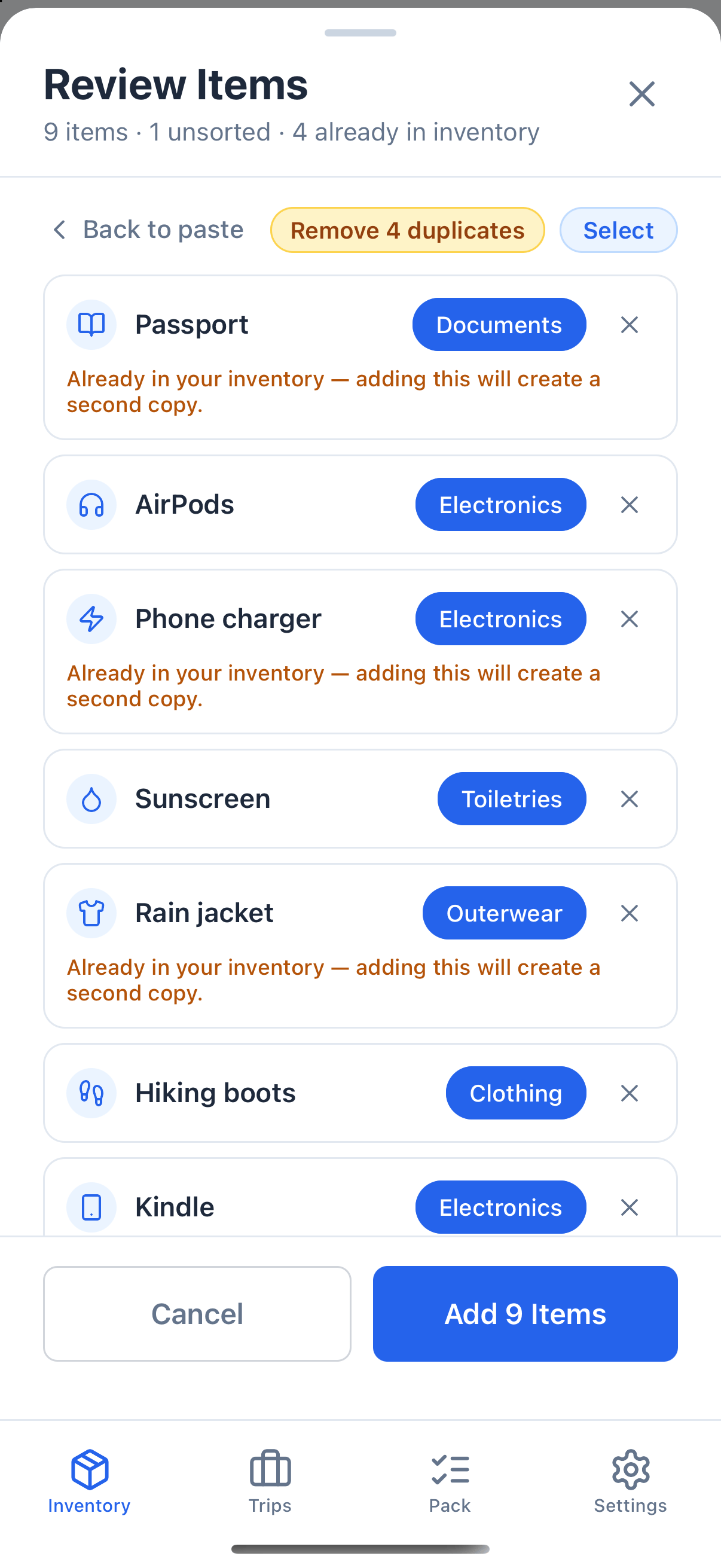 The Review Items screen for nine items. AirPods and Kindle are suggested as Electronics, Sunscreen as Toiletries and Rain jacket as Outerwear. Rows already in the inventory carry a note saying so, and a Remove 4 duplicates button sits above the list.