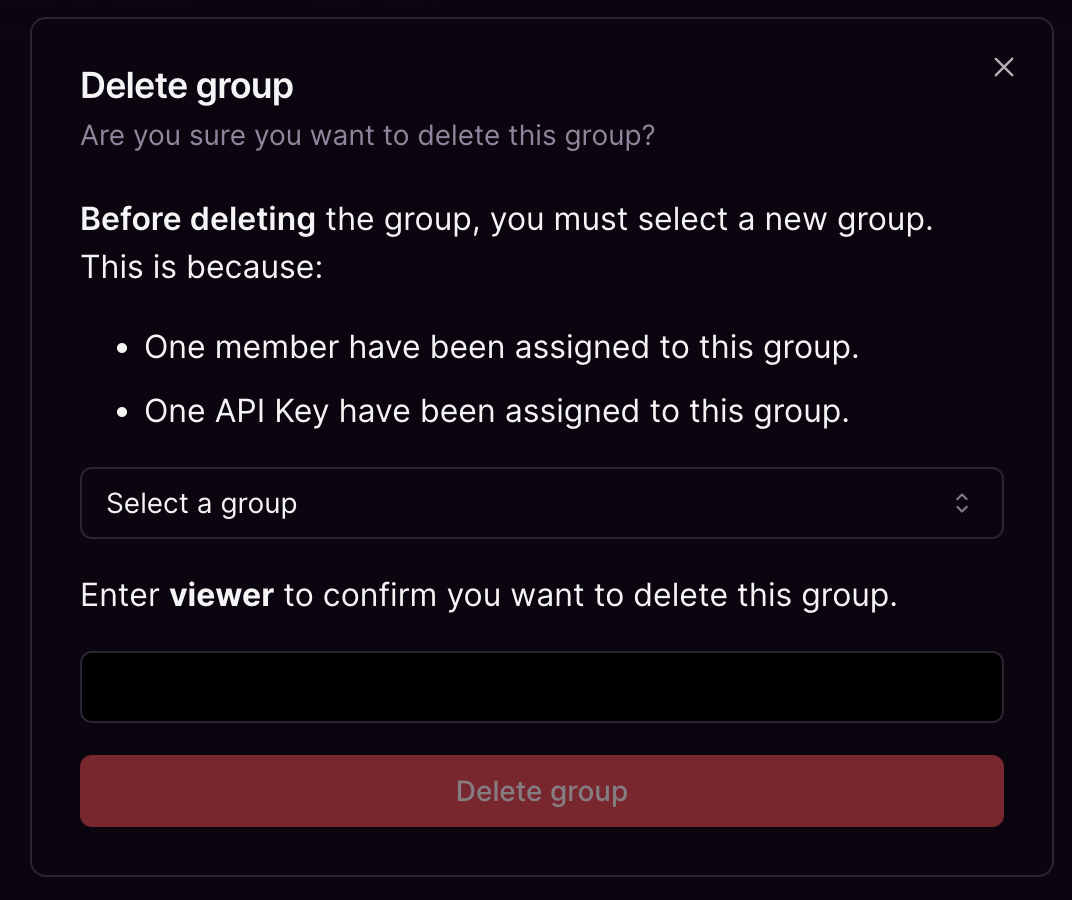Confirmation dialog for deleting a group that requires selecting a new group. One member has been assigned to this group. One API key has been assigned to this group.