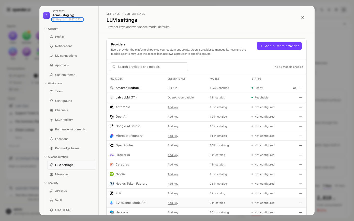 LLM settings provider table with a custom provider row reading OpenAI-compatible, 1 in catalog and Reachable, among the built-in providers