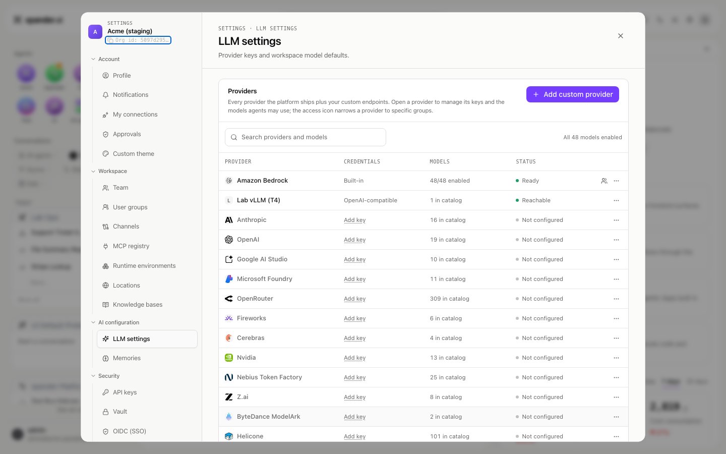 LLM settings provider table with a custom provider row reading OpenAI-compatible, 1 in catalog and Reachable, among the built-in providers