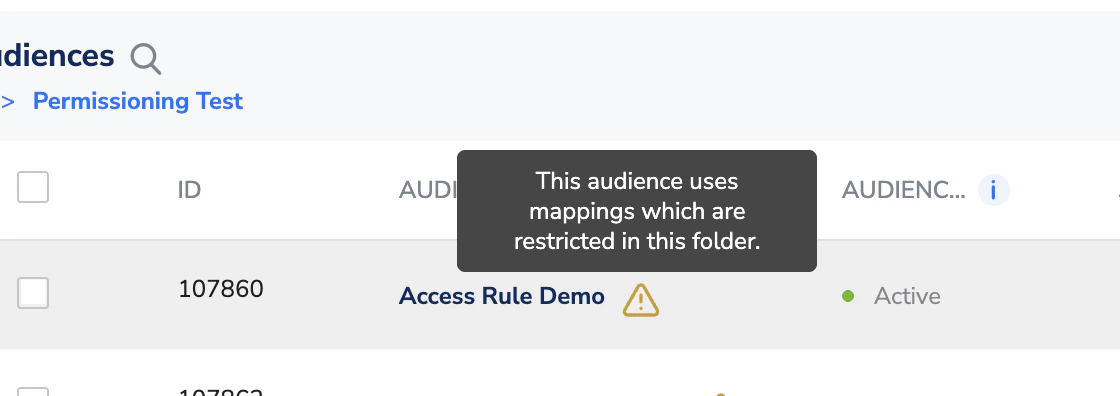 Audiences list showing a row with a warning icon and tooltip about restricted mappings.