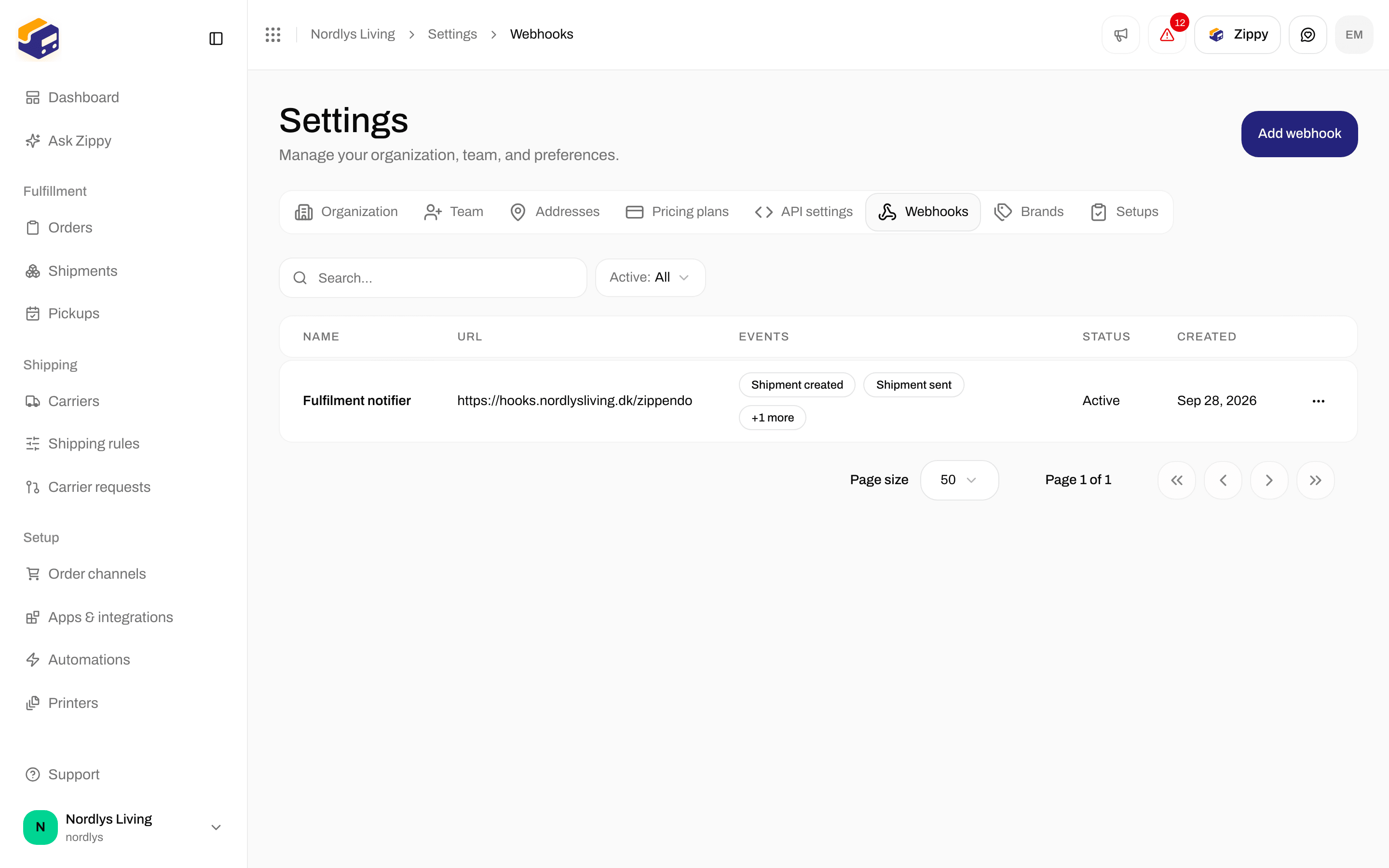 Webhooks list in Settings with a webhook subscribed to shipment and tracking events