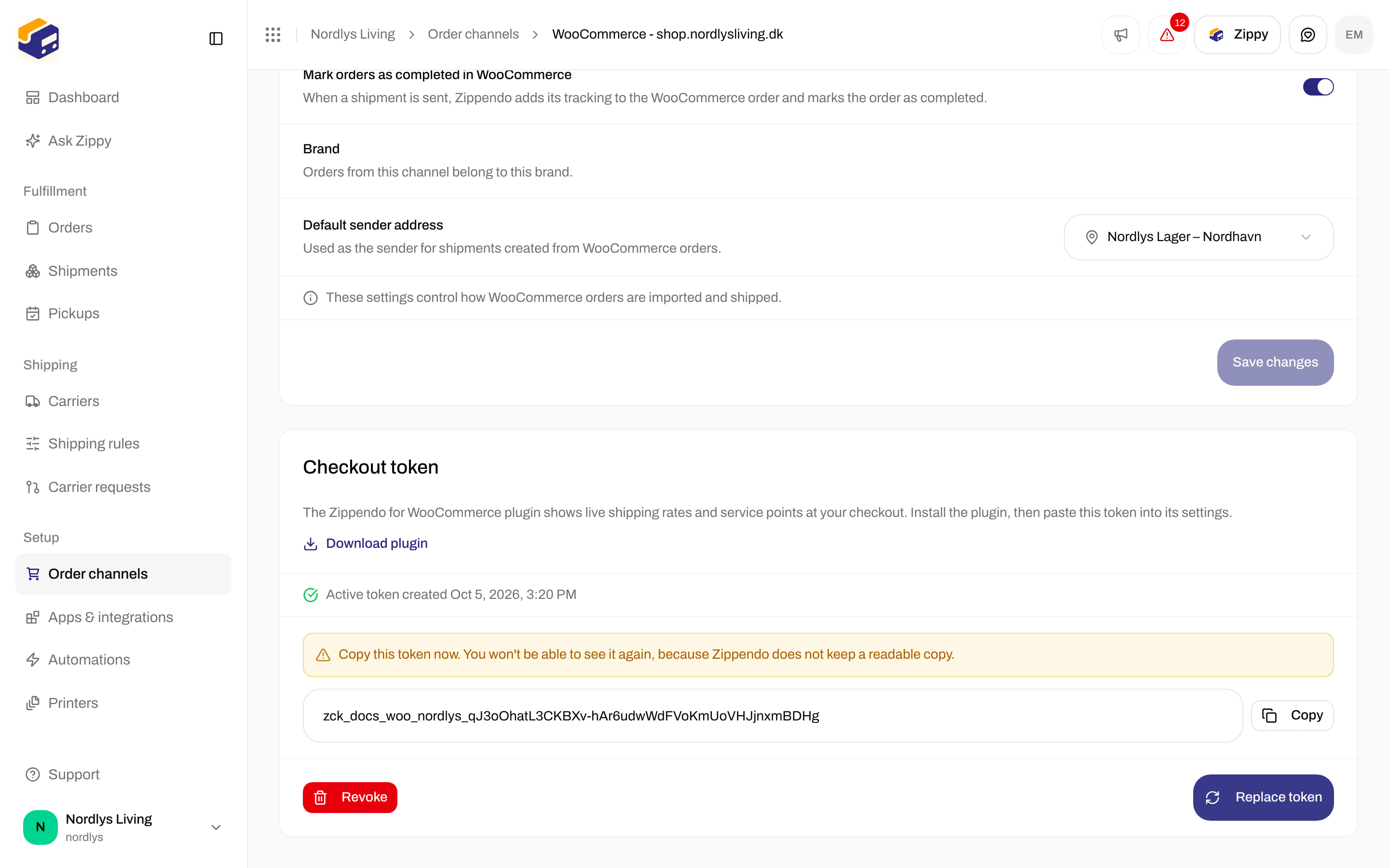 Checkout token card with the one-time warning, the token, Copy, Revoke and Replace token