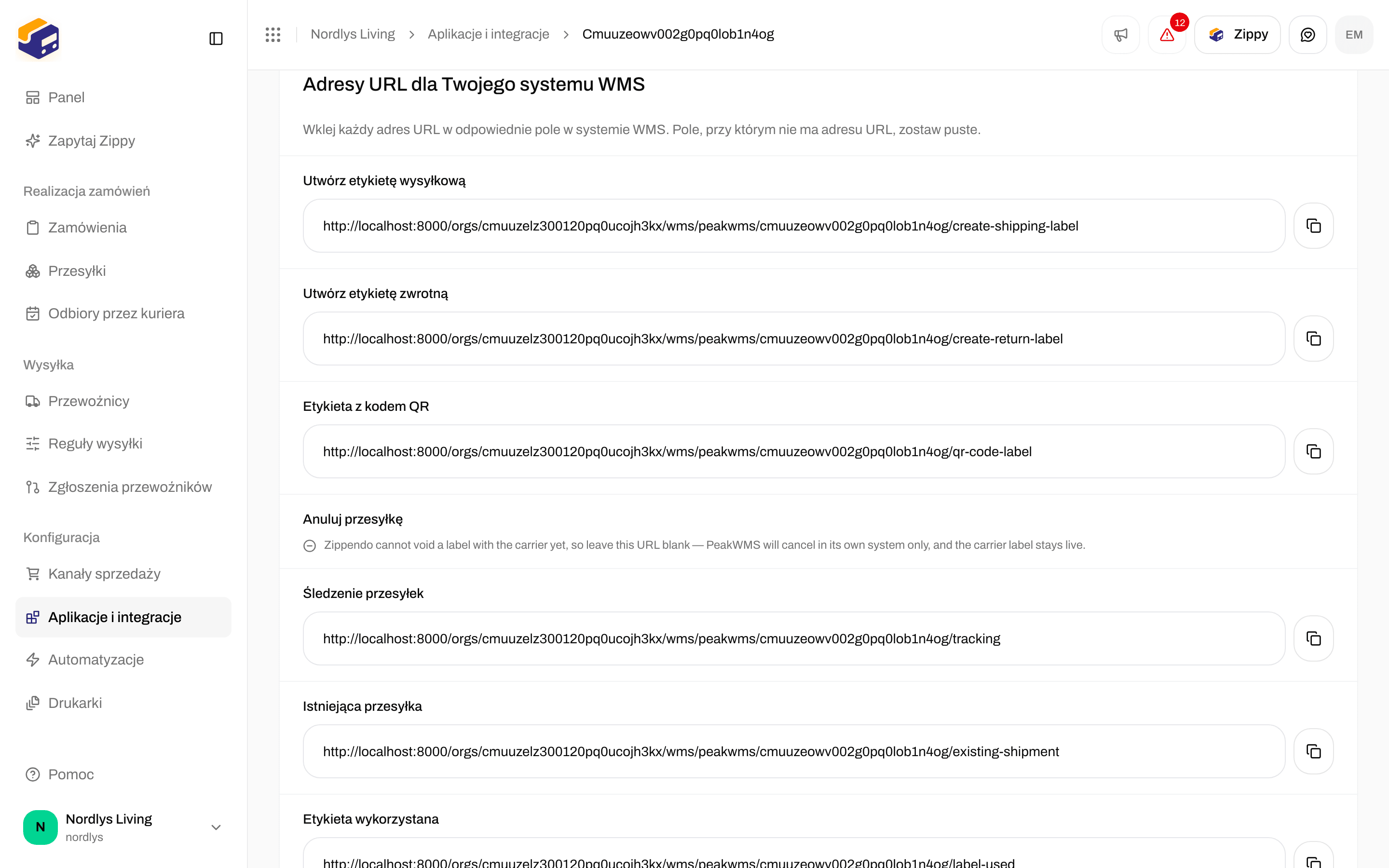 Sekcja Adresy URL dla Twojego systemu WMS z listą: Utwórz etykietę wysyłkową, Utwórz etykietę zwrotną, Etykieta z kodem QR, Śledzenie przesyłek, Istniejąca przesyłka i Etykieta wykorzystana, z przyciskami kopiowania