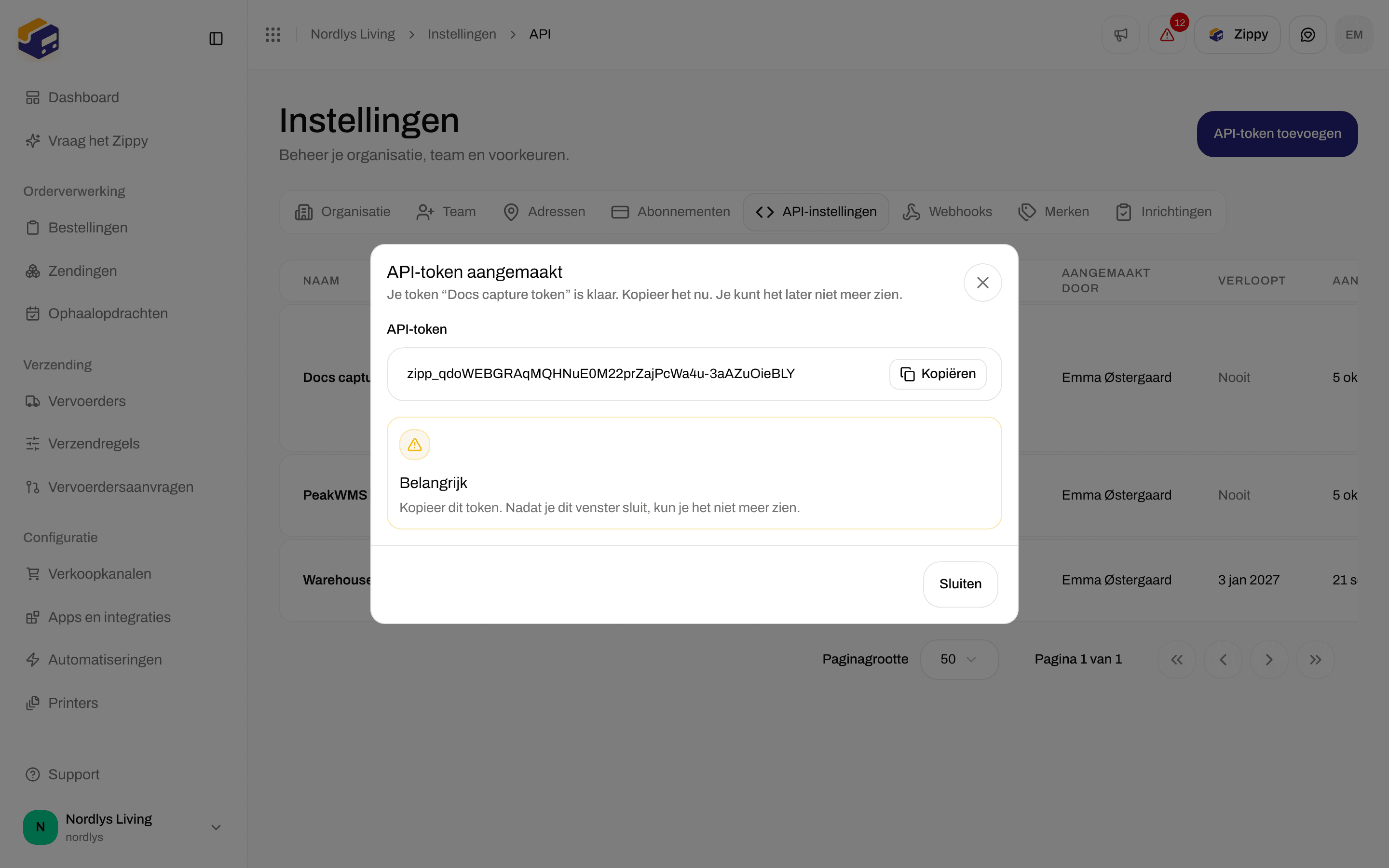 Venster API-token aangemaakt met het token, een knop Kopiëren en een waarschuwing Belangrijk