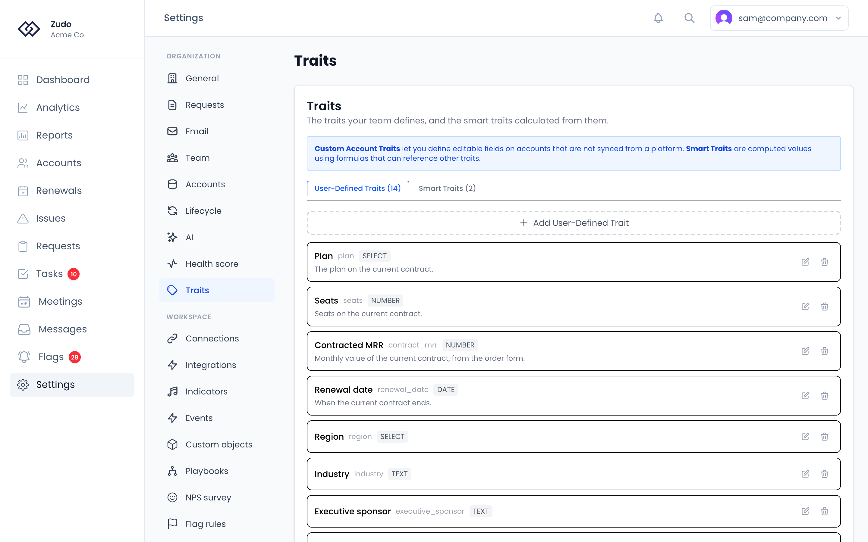 Settings → Organization → Traits: tabs for user-defined and smart traits, the traits your team has defined, and the button to add one