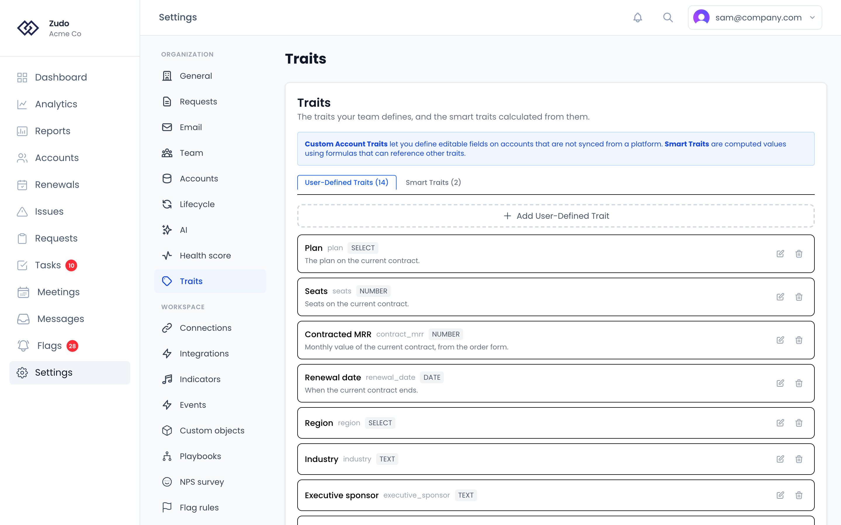 Settings → Organization → Traits: tabs for user-defined and smart traits, the traits your team has defined, and the button to add one